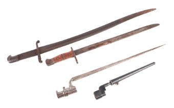 A WWI bayonet with wooden handle; together with another bayonet; two spike bayonets. (4)