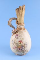 A continental Bohemian amphora dragon handled ewer with floral decoration, 34cms high.