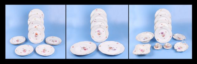 A quantity of KPM Berlin porcelain decorated with flowers and butterflies to include dinner plates