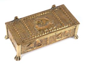 A Newlyn style brass table top box decorated with ships, 19cms wide.