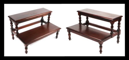 A pair of George III style mahogany two-tread bed steps with turned supports, 80cms wide; together