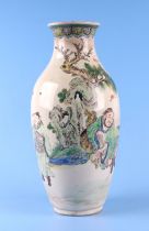 A late 19th century Japanese Satsuma baluster vase decorated with figures in a landscape, red seal