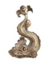 A Regency style cast brass doorstop in the form of a stylised dolphin, 35cms high.