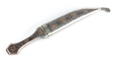 An Iraqi Marsh Arab white metal (silver) niello and yellow metal inlaid dagger, 33cms long Condition