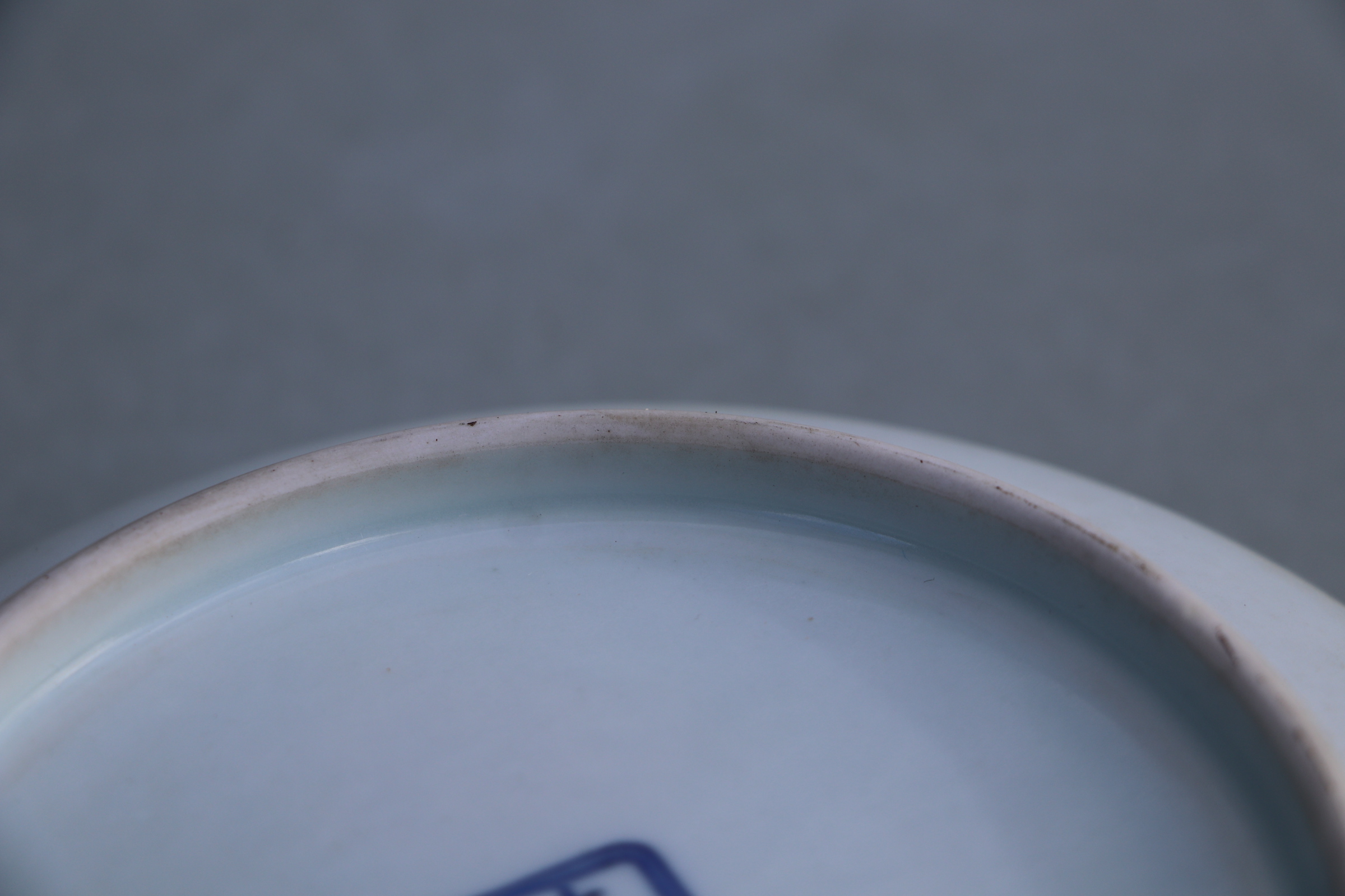 A Chinese white glazed shallow footed bowl, blue six character mark to base, 18cms diameter. - Image 6 of 9