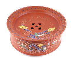 A Chinese Yixing pottery stand decorated enamelled dragons with impressed seal mark to the