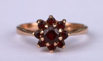 A 9ct gold garnet cluster ring, approx UK size 'L', 1.8g