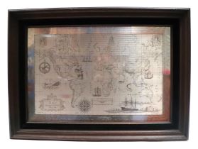 A Royal Geographical Society sterling silver world map, 56 by 38cms, framed.