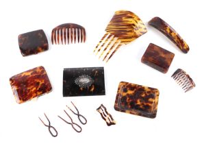 A collection of tortoiseshell and faux tortoiseshell items to include a white metal inlaid