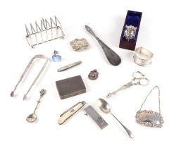 A small quantity of silver collectable items to include a six-division toast rack; cigar cutter;