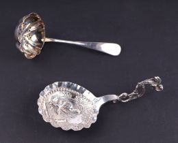 A George V silver caddy spoon with repousse decoration in the Dutch taste, Sheffield 1919, 24g;