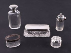 A group of silver mounted cosmetic jars, various dates and makers. (5)