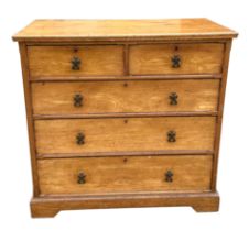 A late 19th century ash chest with two short and three graduated long drawers with Gothic brass