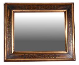 A gilt framed wall mirror with painted decoration, overall 50cm by 60cm.