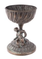 A Grand Tour style bronze table centrepiece with cherub column holding a bowl aloft, 20cms high.