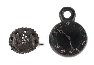 A Victorian Irish bog oak carving in the form of a pocket watch with Roman numerals, 4cms