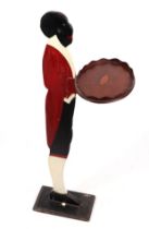 A novelty Georgian style painted wooden footman holding a calling card tray, 85cms high.