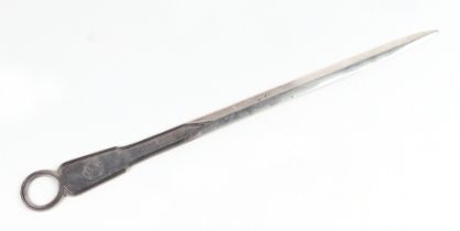 An Irish silver meat skewer, Dublin 1830 and maker's mark for Phillip Weekes, crested, 35cms long.