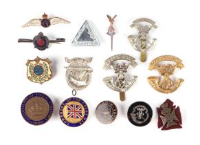 A group of military badges to include POW Association and Gloucestershire Special Constable.