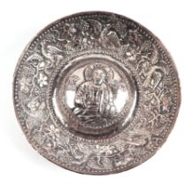 A Ottoman / Greek white metal repousse bowl with central saint figure, 14cms diameter.