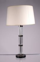 A modern design glass table lamp with octagonal column, 44cms high excluding fittings. Condition