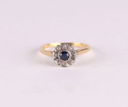 An 18ct gold diamond and sapphire cluster ring, approx UK size O, 2.7g