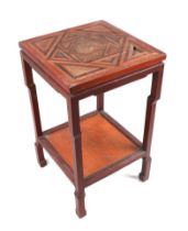 An Indian two-tier hardwood side table the top with a parquet design inlaid top, 43cms wide.