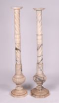 A near pair of alabaster columns, 120cms high (2).