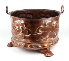 A large Victorian copper two-handled log bin on three paw feet, 45cms diameter. Condition Report