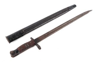 A WWI K bayonet with 42cms long double fuller steel blade with metal and leather scabbard.
