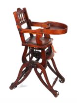 An Antique oak child's metamorphic highchair,