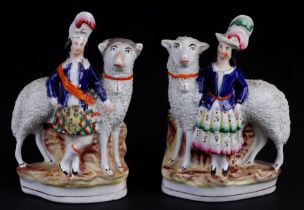 A pair of 19th century Staffordshire figures, Highlanders with large sheep, 20cms high (2).