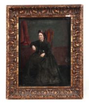 A Victorian overpainted print depicting a lady in mourning dress, 17 by 21cms, framed & glazed.