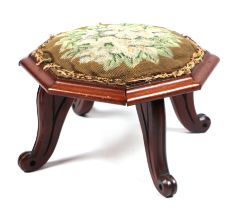 A walnut and needlework covered stool, 30cms wide.