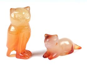 A carved agate owl, 6cms high; together with a similar pussy cat, 5cms long (2).