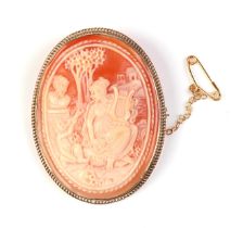 A 9ct gold and carved shell cameo brooch depicting a classical scene, 11.8g.