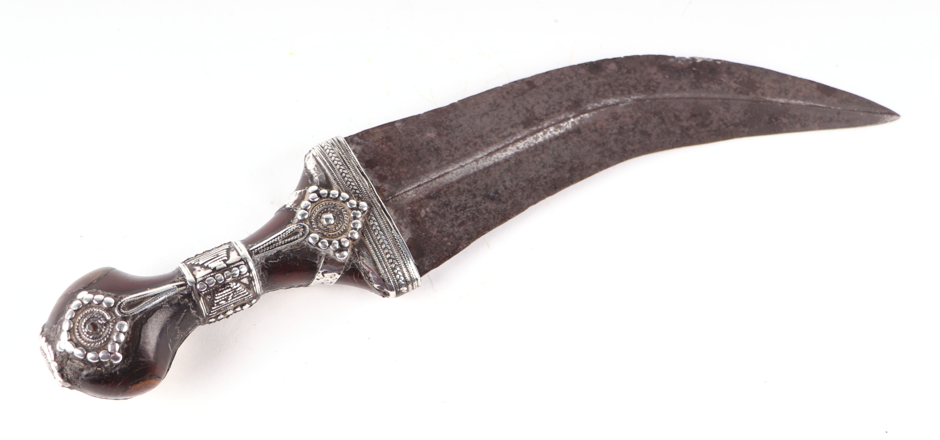 An Arabic Jambiya dagger with withe metal mounted horn handle, 33cms long.