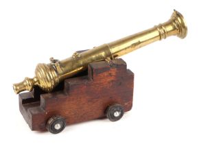 19th century French bronze signal cannon on a later wooden carriage and wheels. Overall barrel