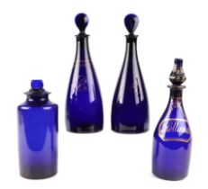 A 19th century gilded Bristol blue glass bottle labelled 'Hollands', 23cms high; together with a