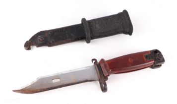 A Russian AKM type bayonet with integral wire cutter in its metal scabbard. Blade length 15cms (