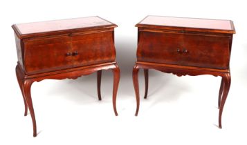 A pair of French bedside cabinets, possibly fruitwood, the rectangular top above a brushing slide