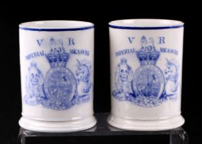 A pair of early Victorian Davenport port tankards with large 'VR' Imperial Measure crest to the