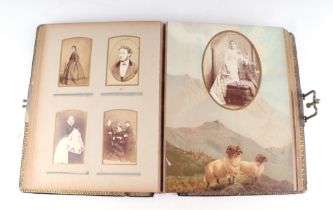 An Edwardian leather photograph album, the cover with embossed thistle decoration, containing