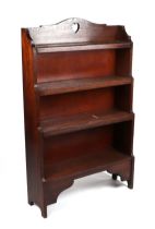 A Liberty style oak four-tier open bookcase, 74cms wide. Condition Report General wear, stable