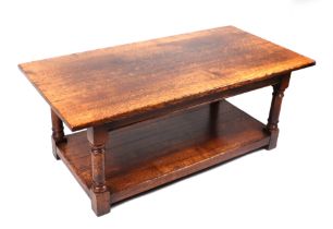 A George III style oak coffee table, 122cm wide