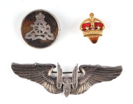 An American USAF Bomber Command silver badge; together with a Royal Artillery silver and