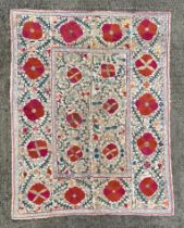 A 19th century Central Asian Suzani embroidered wall hanging, possibly Uzbekistan, cotton silk chain