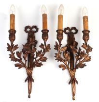 A pair of gilt bronze twin arm wall lights, cast with mistletoe leaf and berry decoration, 46cm high