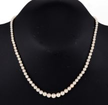 A graduated pearl necklace with sterling silver pearl and marcasite clasp, total length 42cms.