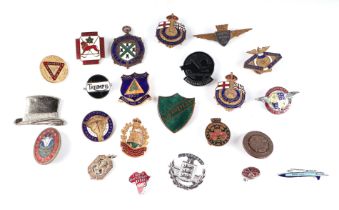 A quantity of enamel badges to include a silver Scout badge.